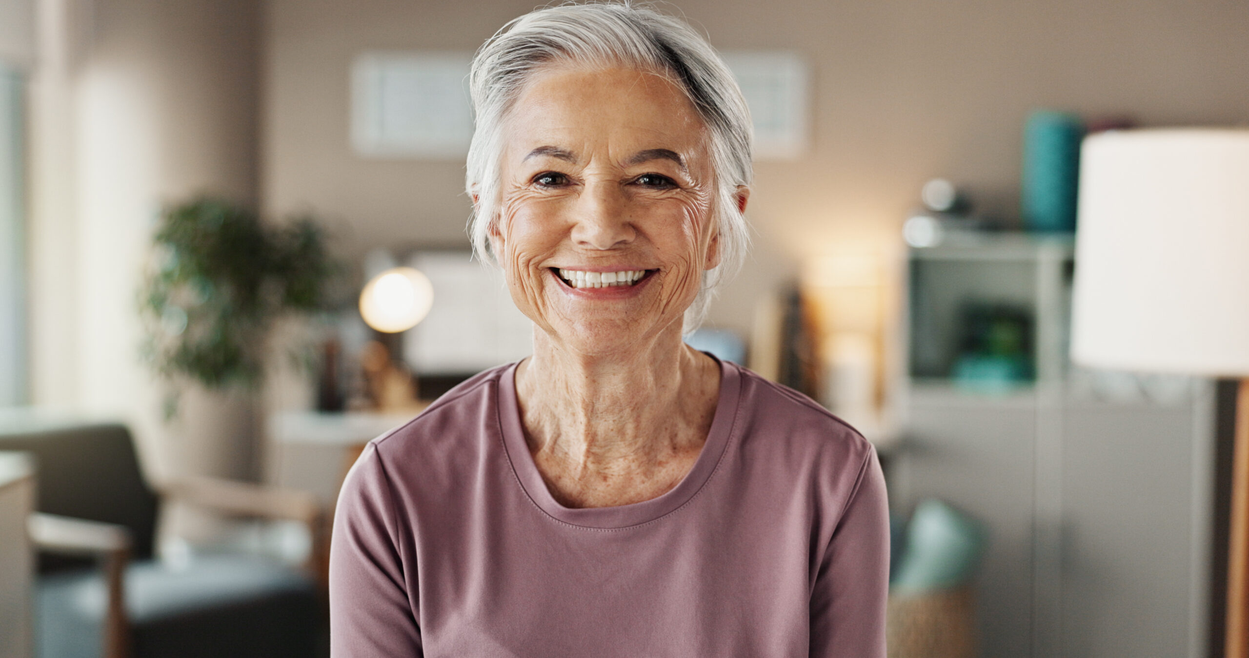 Senior woman, portrait and smile with dental treatment, whitening results and cleaning confidence. Hygiene, mouth health and cosmetics for dentures, oral care and satisfaction for teeth aesthetic.