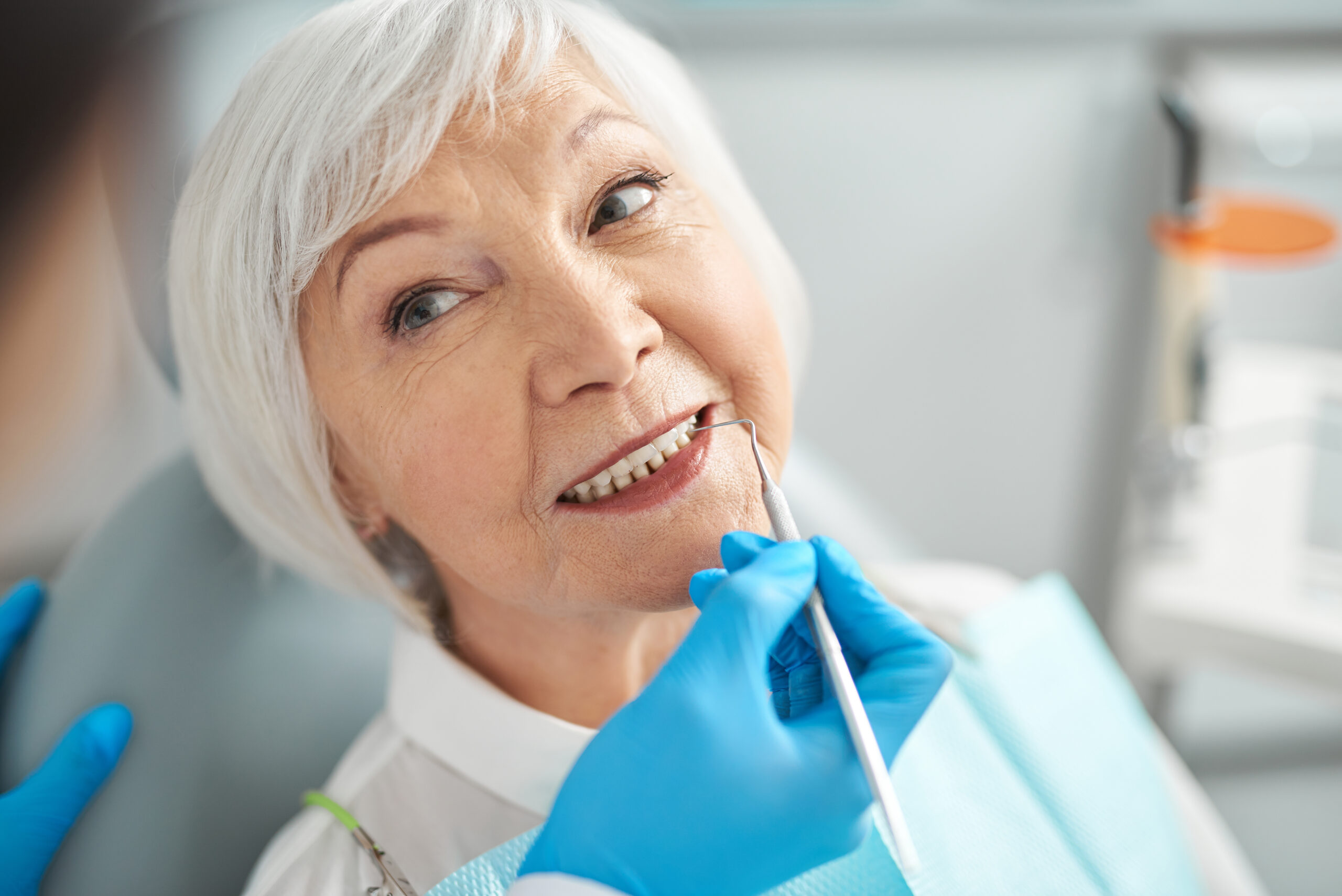 Portrait of a pleasant senior woman at the dental surgeon